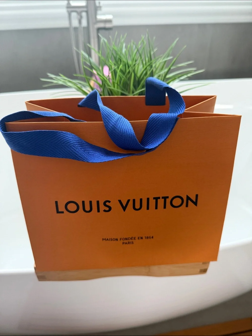 Small Louis Vuitton Orange Shopping Bag with Blue Ribbon Handles. 9X7 inches.